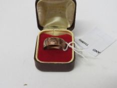 9ct gold engraved band, size 5 1/2, weight 4.8gms. Estimate £50-60.