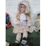 Large A.M. Germany bisque doll, circa 1930's, approx. 72cms height. Estimate £80-100.