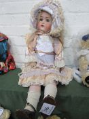 Large A.M. Germany bisque doll, circa 1930's, approx. 72cms height. Estimate £80-100.
