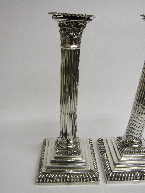 A pair of silver candlesticks by Hawksworth Eyre & Co Ltd, Sheffield, 1893 in the shape of - Image 2 of 3