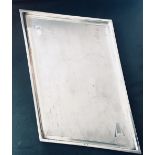 Superb Art Deco sterling silver tray. Formed in a sloping rectangle shape with a machine cut