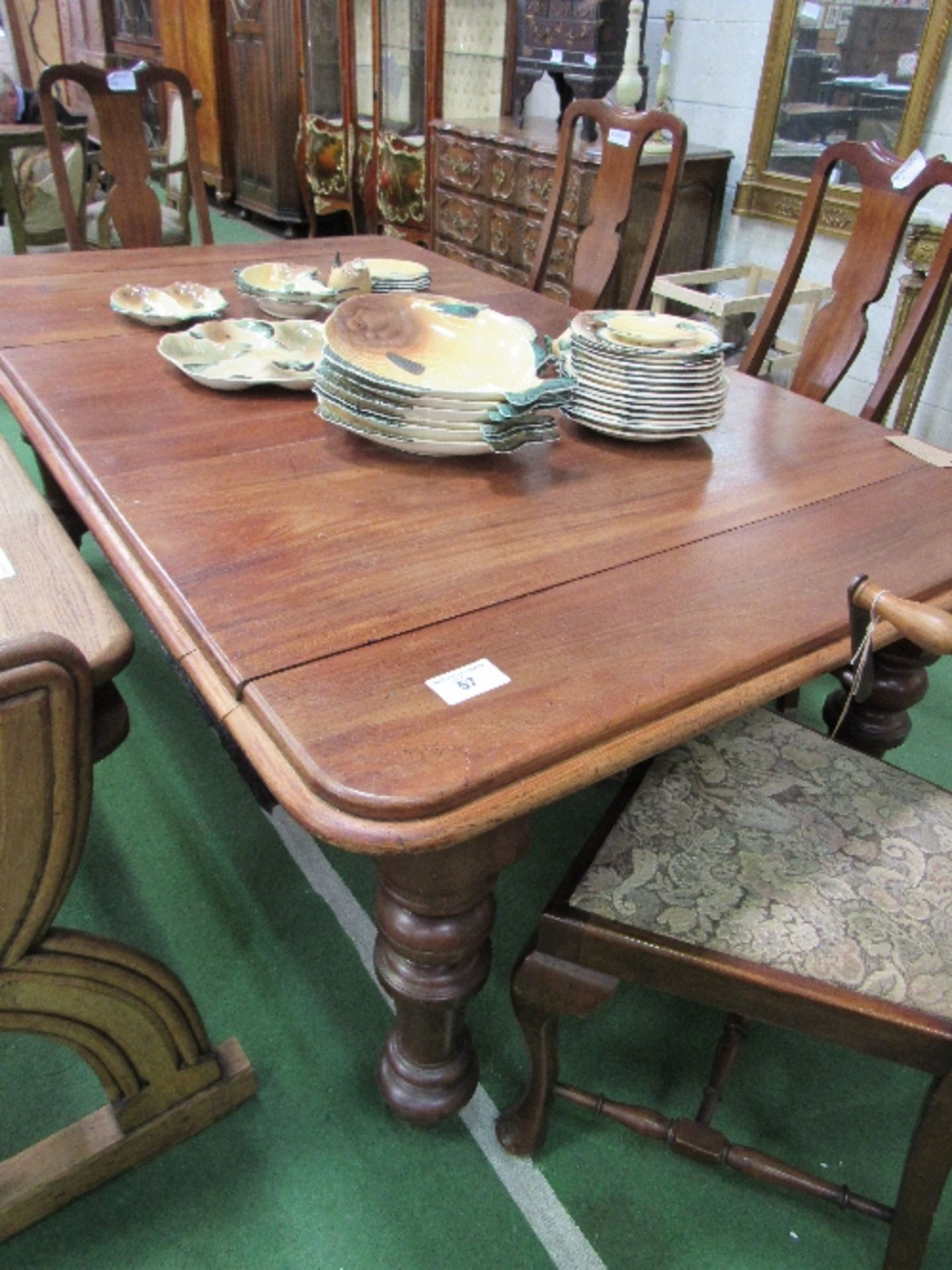 Mahogany wind-out dining table on heavy turned legs c/w handle, 190cms x 100cms x 74cms. Estimate £