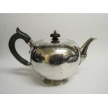 Silver teapot by Garrards of London with a wooden handle & knob, engraved with crest of rampant lion