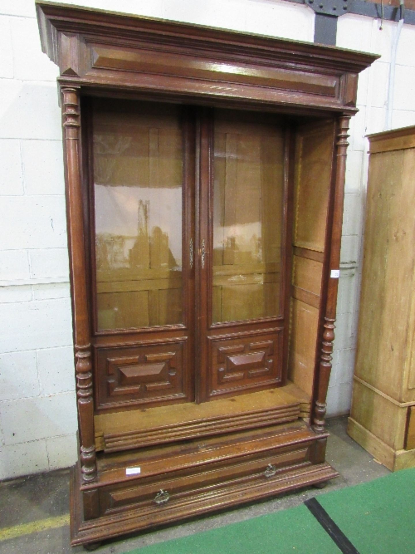 French oak glazed bookcase with drawer to base on bun feet, 126cms x 55cms x 220cms. Estimate £50- - Image 2 of 2