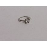 18ct (stamped) white gold ring with clear centre stone, size T 1/2, weight 3.2gms. Estimate £20-30.