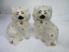 A pair of Beswick miniature Staffordshire dog figurines. Estimate £20-30.