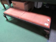 Low footstool on ball feet upholstered with deer hide, 133cms x 40cms x 32cms. Estimate £20-40.