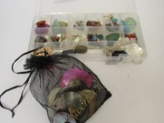 Case of mother of pearl buttons & beads & other semi-precious stones. Estimate £10-20.