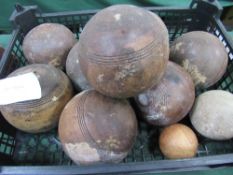 8 old rosewood lawn bowls. Estimate £10-20.