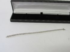 18ct white gold tennis bracelet with 59 diamonds, approx. 2ct. Estimate £750-800.