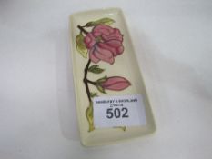 Moorcroft magnolia rectangular dish. Estimate £10-20.