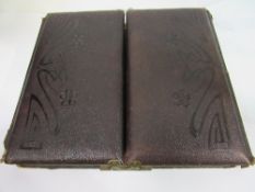 A late Victorian photograph album containing approx. 43 family photographs. Estimate £10-20.