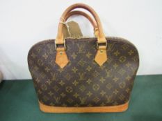 Louis Vuitton handbag of monogrammed canvas with brown leather trim & handle. Estimate £150-200.