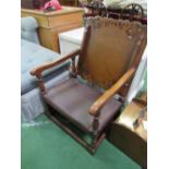 Oak framed metamorphic chair/table with brown leather seat. Estimate £40-60.