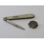 Edward VII silver fruit knife, 1902 & a George V silver sixpence in a silver mount. Estimate £20-