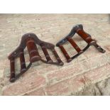 Two mahogany and metal harness pad racks by Musgrave, Belfast