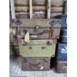 Two vintage canvas-covered travel cases and one other