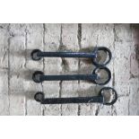 Three black metal carriage spanners