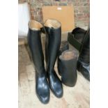 Pair of long black rubber boots, size 8½ / 42 and a pair of black leather gaiters
