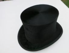 Black silk top hat by Dunn & Co with cardboard hat box