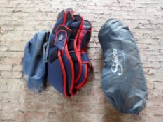 Two sets of full size navy and red travel boots by Shires with covers