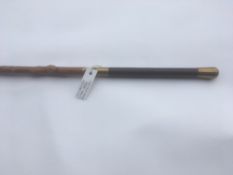 Holly four-in-hand whip, with leather hand part and turned carving on the stick, and a small 'W'