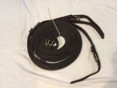 A new pair of brown leather pair reins, 150ins