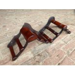 Two mahogany and metal racks (one pad/one bridle) by Musgrave, Belfast (pad rack damaged)
