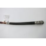 An interesting and rare whip with a finely plaited leather handle, ornate ferrule and butt cap.