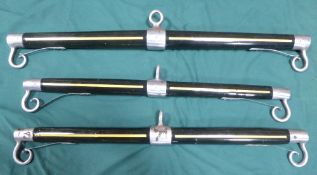 Spare set of team bars painted black with yellow lines