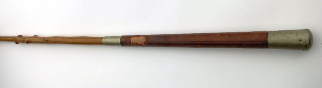 Holly driving whip with leather hand part and brass mounts. Approx. length 56ins, plus thong (view