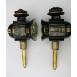Pair of black/brass round fronted carriage lamps (1 with convex lens) and pie crust tops, engraved