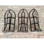 Three black painted metal saddle racks by Cottam & Willmore, London