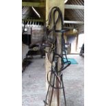 A full size leather snaffle bridle with rubber reins, together with two leather foal slips