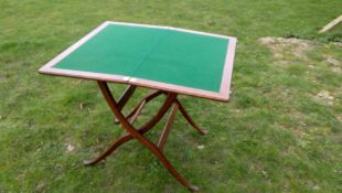 A fine mahogany folding coach/games table with small drawer containing various compartments. When