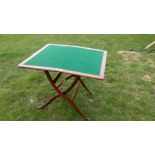 A fine mahogany folding coach/games table with small drawer containing various compartments. When