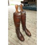Pair of fine brown leather military long boots with laces and buckles to the front, complete with