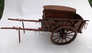 Wooden model of a two wheel farm tip cart with shaft stands and brass fittings. Length 24ins