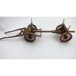 Wooden model of a four wheel timber wagon with brass decoration. Length approx. 35ins