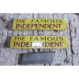 Two wooden coach boards painted yellow and sign-written The Famous 'Independent' and small wagon