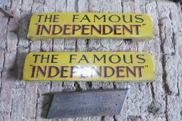 Two wooden coach boards painted yellow and sign-written The Famous 'Independent' and small wagon