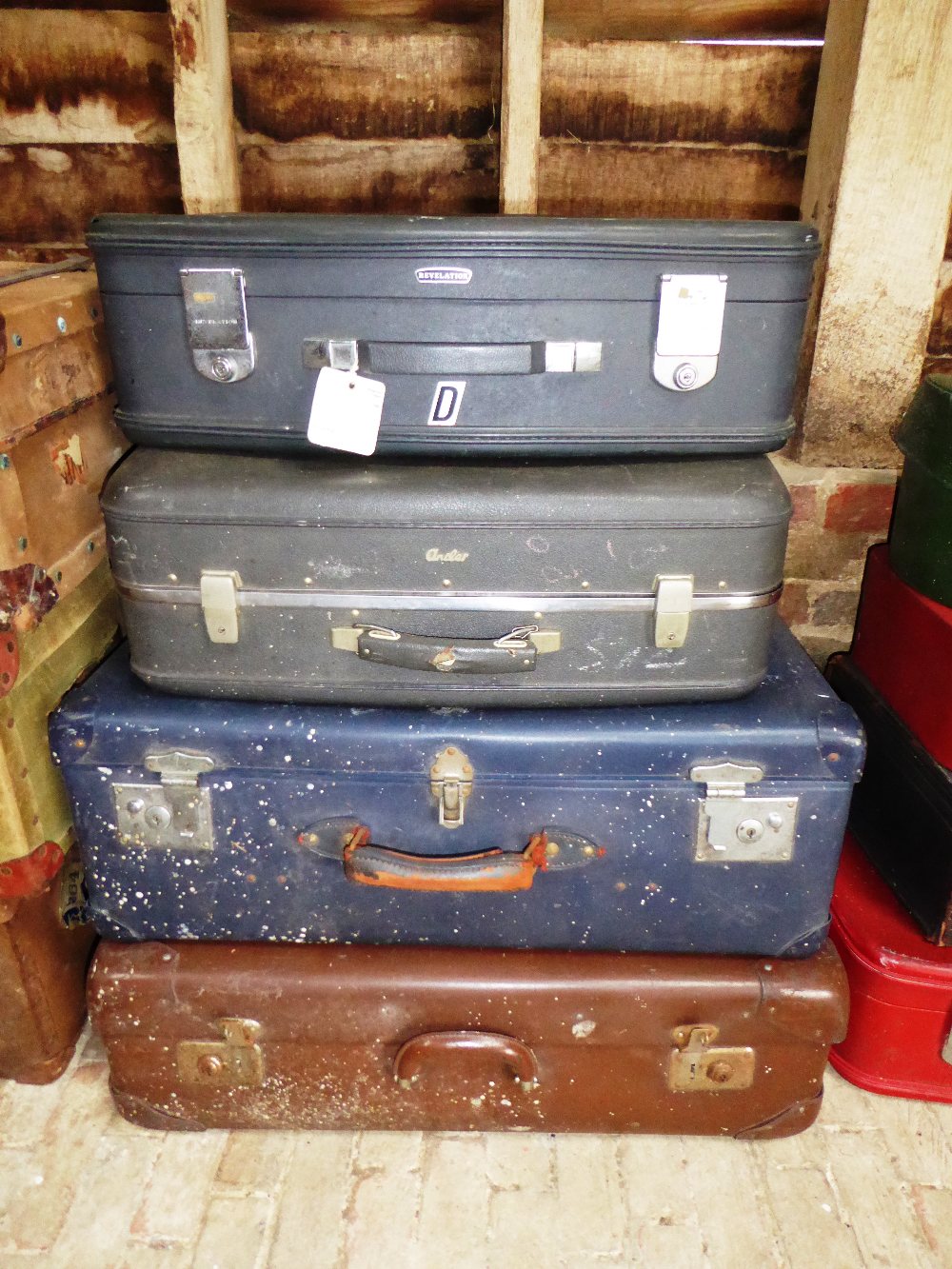 Four various suitcases including 'His & Hers' suitcases from a classic or vintage car (handles