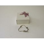 Pandora charm bracelet with 5 charms. Estimate £30-50.
