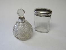 Silver topped glass dressing table pot, London 1911 & a silver topped cut glass toilet water bottle,