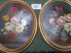 2 circular framed oil on boards of still life flowers signed R Rosini. Estimate £10-20.