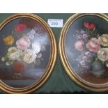 2 circular framed oil on boards of still life flowers signed R Rosini. Estimate £10-20.