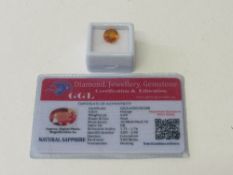 Natural oval cut orange sapphire, 6.0 carat, with certificate. Estimate £50-70.