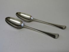 2 mid-18th century silver serving spoons by GB London, 1744, wt 2.23ozt. Estimate £150-200.