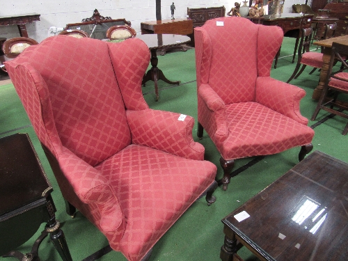 2 upholstered wing armchairs. Estimate £50-80.