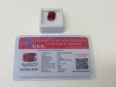 Natural cushion cut ruby, 9.7carat, with certificate. Estimate £50-70.